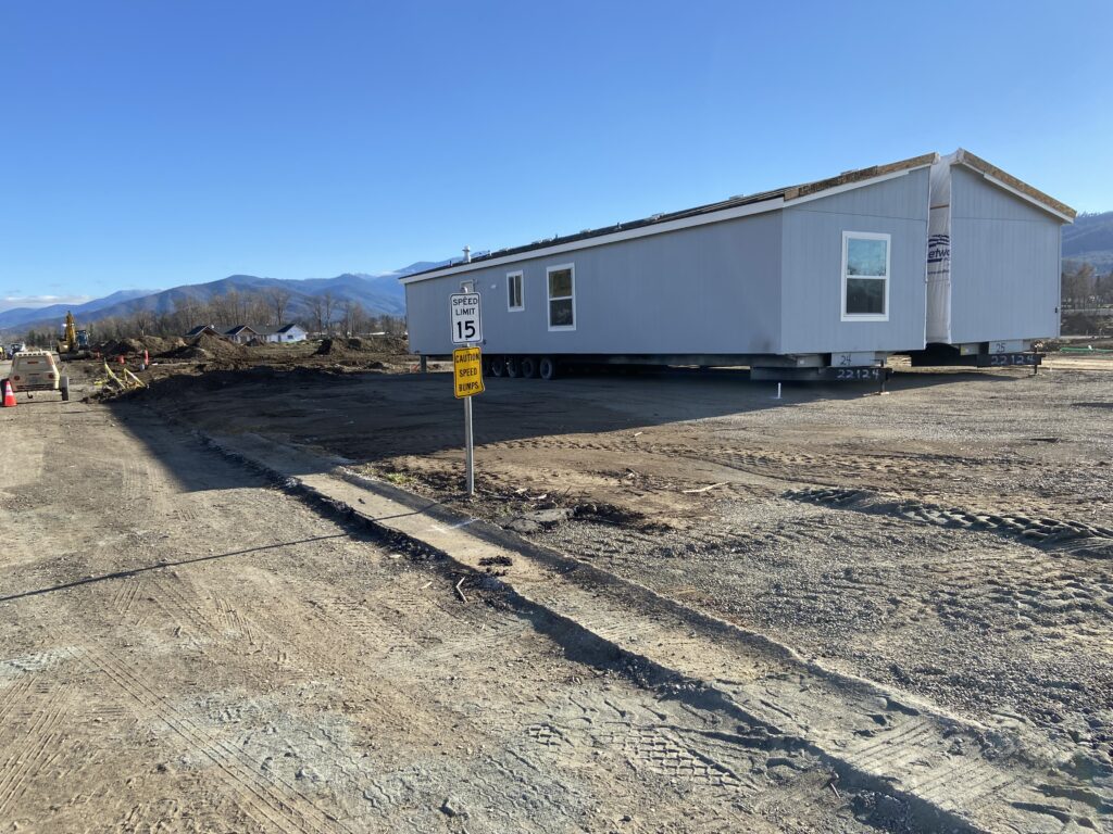 A mobile home is being built in the middle of the road.