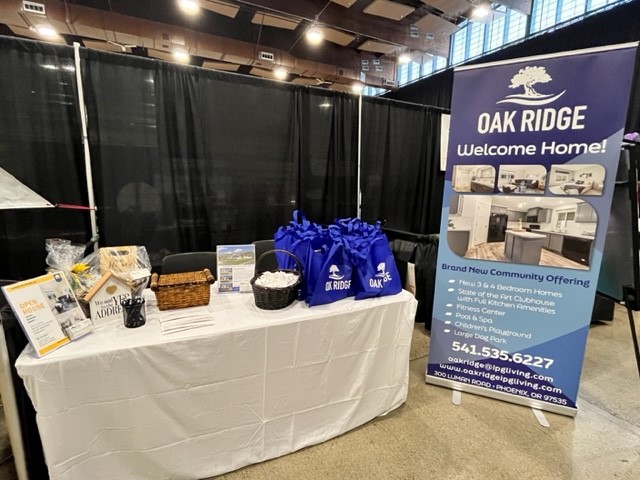 A booth with a banner for oak ridge homes.